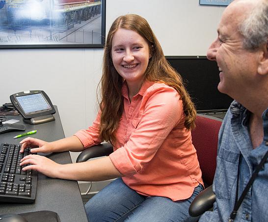 A Carthage student works with a supervisor during an internship at NASA.